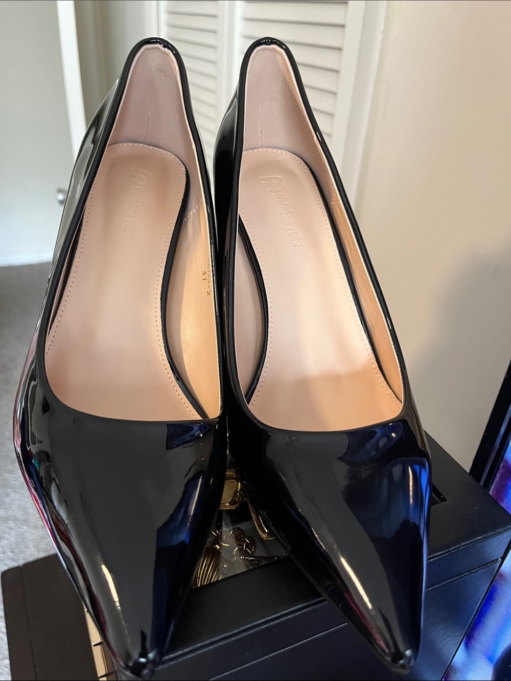 Black Patent Pointed-Toe Pumps with red bottoms